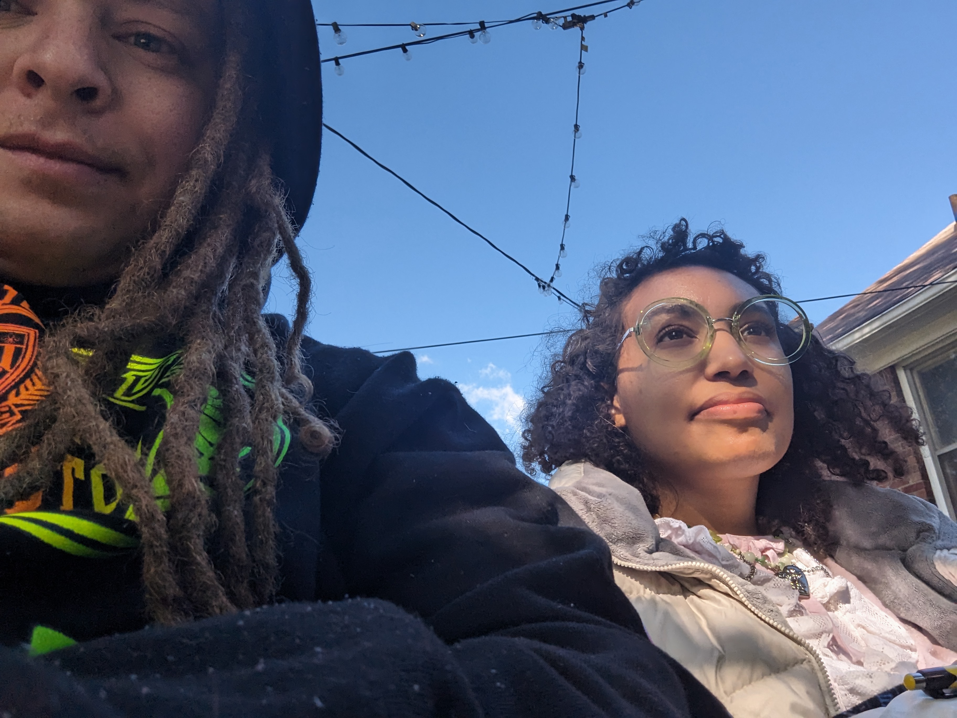 A selfie of Lance and Karen, two members of Detroit Peer Respite. Lance smiles directly into the camera while Karen looks off into the distance.